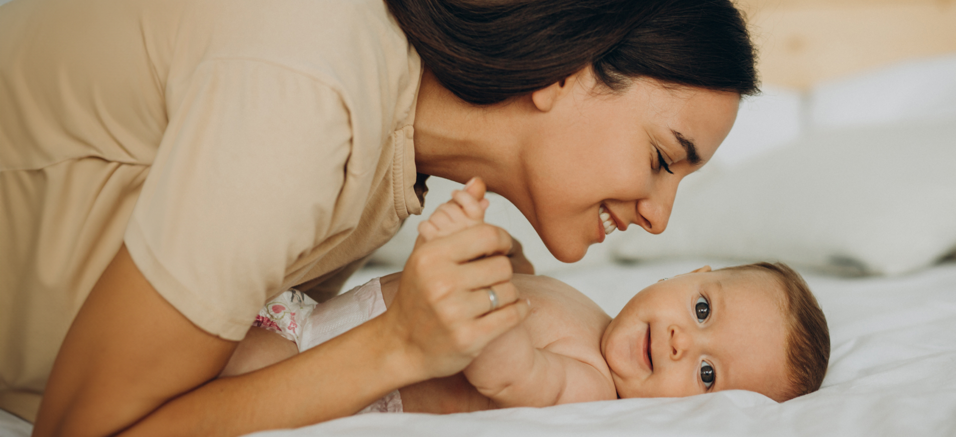 mother-with-baby-daughter-lying-bed